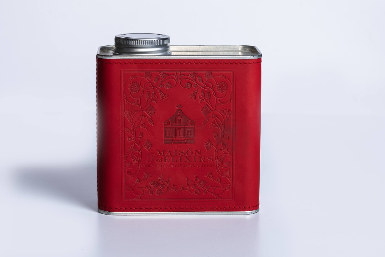 Maison Des Élixirs red embossed coffee tin